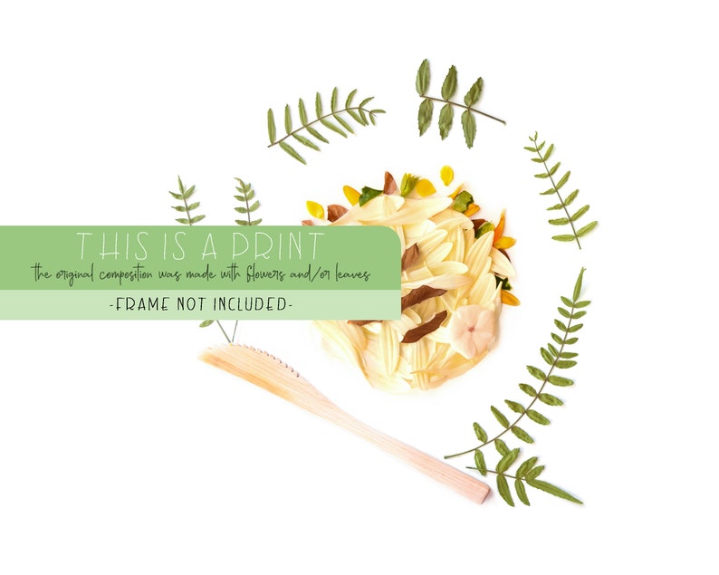 May include: A print of a floral arrangement made with dried flowers and leaves. The print is surrounded by green fern leaves. The text "THIS IS A PRINT" is at the top of the image. The text "the original composition was made with flowers and/or leaves" is below the first line of text. The text "-FRAME NOT INCLUDED-" is at the bottom of the image.