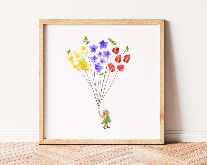 May include: A framed art print featuring a whimsical illustration of a person holding a bouquet of colorful flowers, including yellow, blue, and red.