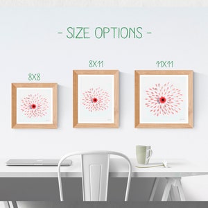 May include: Three framed prints of a pink and red flower with a white background. The frames are light brown wood. The prints are available in three sizes: 8x8 inches, 8x11 inches, and 11x11 inches.
