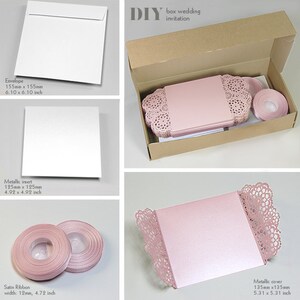 May include: DIY box wedding invitation kit with a pink metallic cover, white envelope, white insert, and pink satin ribbon. The cover has a delicate lace design. The box is made of brown cardboard.