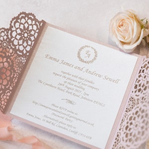 May include: A pink and white wedding invitation with a lace design. The invitation reads "Emma James and Andrew Sewell request the pleasure of your company at their wedding 29th August 2025, 2pm The Lynnhurst Hotel, Park Road, Johnston PAS8LS Please RSVP online at: http://emmajonesandandysewell-gettingmarried.co.uk (Password: Party) Alternatively please reply to Emma Jones, 16 Mill Rd, Clanishen, Cardiff, CF14 QXB"