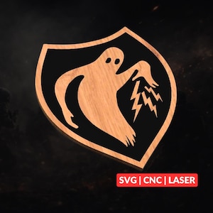 May include: Wooden shield-shaped emblem featuring a ghost design with lightning bolts. The ghost is light brown, set against a black background within a shield. The text "SVG | CNC | LASER" is displayed in red.