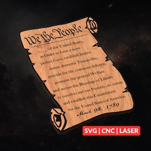 May include: Wooden scroll featuring the text "We the People" and the U.S. Constitution's preamble. The scroll is made of light-colored wood with dark brown engraved text. The date "March 9th, 1789" is visible. The bottom right corner has the text "SVG | CNC | LASER".