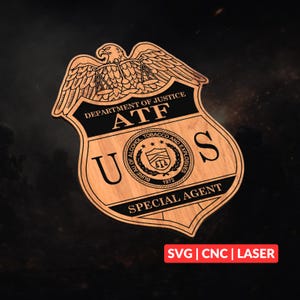 May include: Wooden badge with the text "DEPARTMENT OF JUSTICE ATF" and "SPECIAL AGENT". The badge features an eagle at the top and the words "U S" on either side. The badge also has the text "BUREAU OF ALCOHOL, TOBACCO AND EXPLOSIVES 1972".