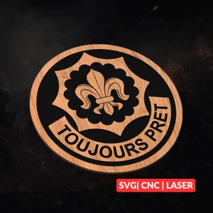 May include: Circular wooden emblem with a black fleur-de-lis design and the words "TOUJOURS PRET" in a circular pattern. The emblem also includes the text "SVG | CNC | LASER" in a red rectangle.