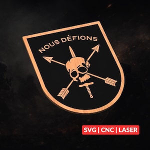 May include: A shield-shaped plaque with a black centre and a light wood border. It features a central skull graphic with two crossed arrows and a dagger pointing downward. The text NOUS DÉFIONS is arched above the skull. The bottom right corner displays the red text SVG | CNC | LASER.