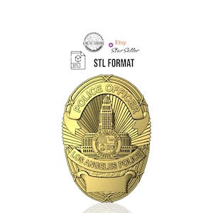 May include: A gold-coloured police officer badge with the text "POLICE OFFICER" and "LOS ANGELES POLICE". The badge features a detailed depiction of a building and the text "STL FORMAT".