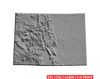 May include: A rectangular gray relief map of the state of Colorado showing detailed topographical mountain ranges on the left and flat plains on the right. The text STL | CNC | LASER | 3-D PRINT is printed in white on a red rectangular background.
