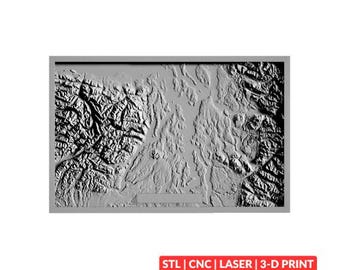 May include: A rectangular gray relief map featuring detailed topographical terrain with mountain ranges and valleys. The map is framed and includes a small rectangular plaque at the bottom. The text "STL | CNC | LASER | 3-D PRINT" is displayed in a red box below the map.