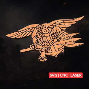 May include: Wooden emblem featuring an eagle with outstretched wings, holding a trident and an anchor. The design is intricately carved with detailed lines and patterns. The text "SVG | CNC | LASER" is displayed in a red rectangle at the bottom.