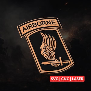 May include: Wooden plaque featuring the word "AIRBORNE" above a black shield with a winged design and a sword. The plaque has a light brown border and the text "SVG | CNC | LASER" at the bottom.