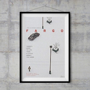 May include: Framed poster for the film "Fargo" in a black frame. The poster displays the title "FARGO" in red, with the text "There's more to life than a little money, you know." and the names of the cast and directors.