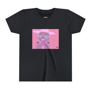 May include: Black t-shirt featuring a pink graphic of a person wearing a hat and sunglasses, with rainbow accents. The graphic has the text "tkjo" in the bottom right corner. The t-shirt is made of a soft material.