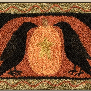 May include: A rug with a black and orange pumpkin design and two black crows on either side of the pumpkin. The pumpkin has a yellow cross in the center.