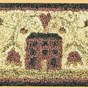 May include: Rectangular rug with a cream-colored background and a black border. The rug features a central design of a red house with a black roof, surrounded by red hearts and floral accents. The rug's dimensions are not visible.