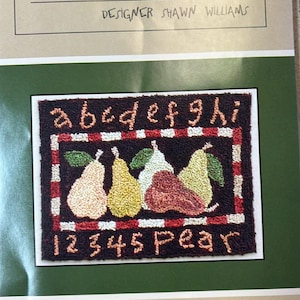 May include: A punchneedle embroidery piece titled "THREADS THAT BIND" by designer Shawn Williams. The design features five colorful pears with the numbers 1-5 and the letters a-i. The piece measures 5" x 3 3/4".