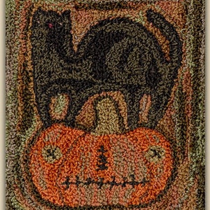 May include: A black cat sits on top of a carved orange pumpkin with a toothy grin. The pumpkin and cat are on a brown background.