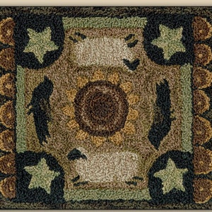May include: A brown, green, and white rug with a sunflower design in the center. The rug has a border of brown circles and stars.