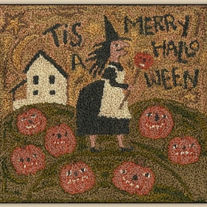 May include: A whimsical needlepoint design featuring a witch with a black dress and white apron, holding a stick with a red flower. The text "Tis a Merry Hallo Ween" is stitched in brown thread. The design is surrounded by a brown background with a white house and orange pumpkins with jack-o-lantern faces.