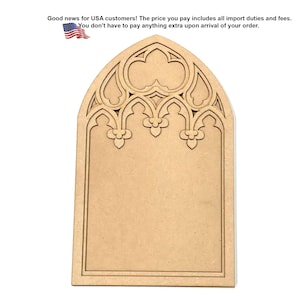 May include: A light brown, flat, wooden cutout shaped like a pointed gothic arch window. The top section features intricate, symmetrical cut-out tracery patterns with trefoil details, while the bottom portion remains a solid, smooth rectangular panel.