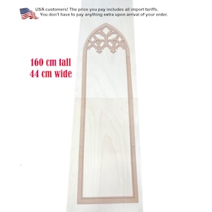 May include: A tall, light-colored wooden frame featuring a pointed gothic arch at the top with intricate cutout tracery details. The frame measures 160 cm tall and 44 cm wide, displaying a clean, flat surface with visible natural wood grain patterns.