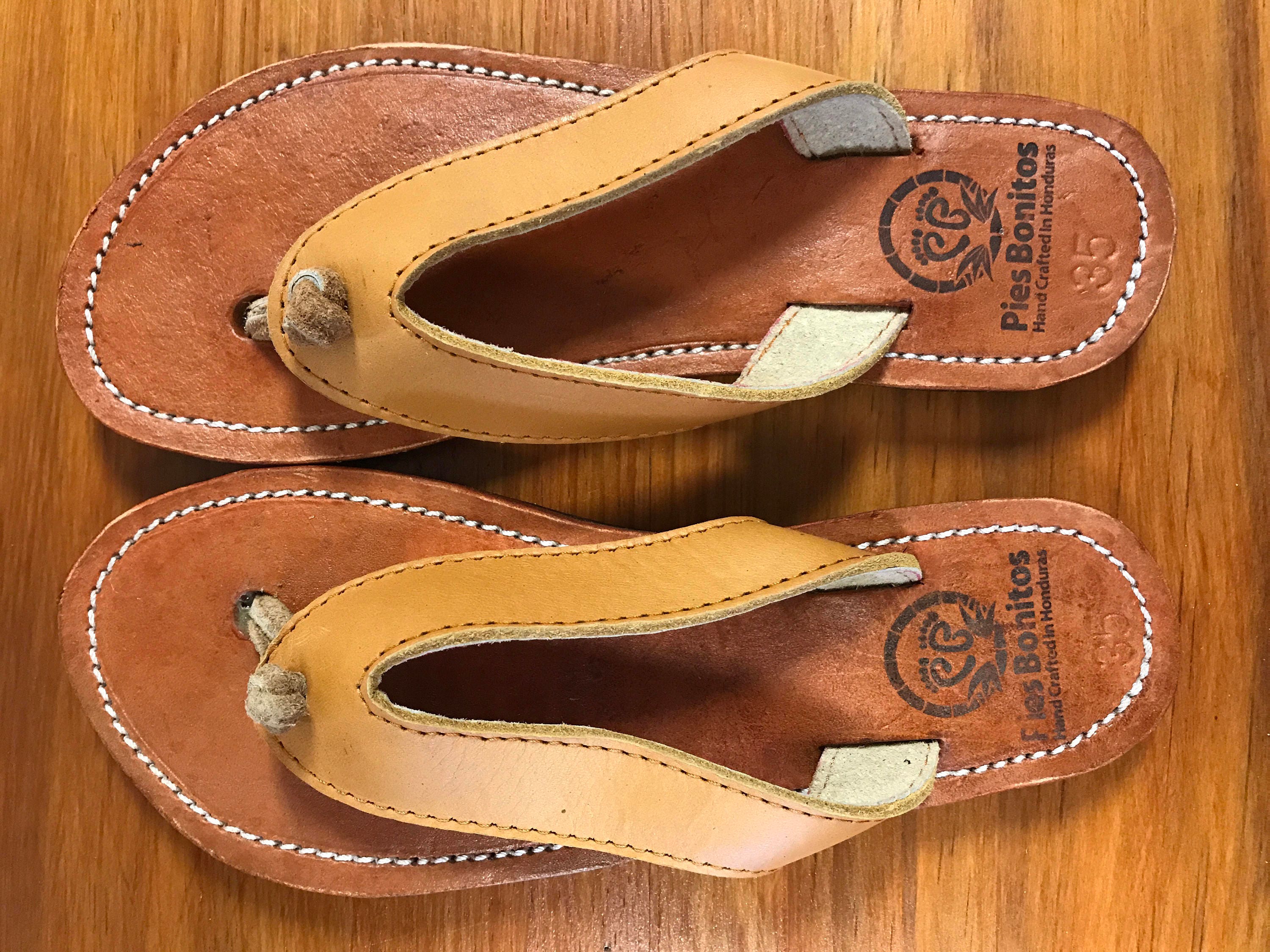 tan and black flip flops