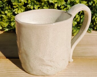 White porcelain soda fired mug