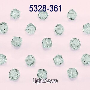May include: A close-up of 5328-361 Light Azore crystal beads. The beads are faceted and have a light green color.