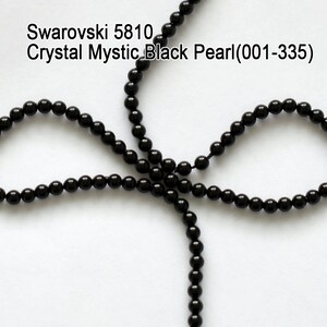 May include: Strands of black crystal beads, arranged in a looping pattern, against a white background. The beads are round and evenly spaced. Text at the top reads "Swarovski 5810 Crystal Mystic Black Pearl(001-335)".