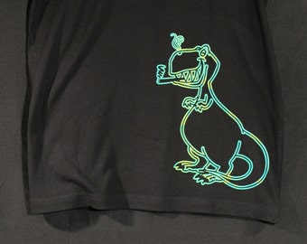 May include: A black short-sleeved t-shirt featuring a neon-style graphic of a dinosaur on the lower right side. The dinosaur is outlined in teal and yellow, depicted with a wide grin and holding a smoking object in its mouth with smoke rising.