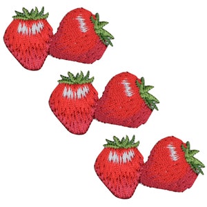 May include: Three pairs of embroidered strawberry patches, each featuring two red strawberries with green leaves and white highlights. The strawberries are rendered in a detailed thread-work style, showcasing a vibrant red colour palette with green stems.