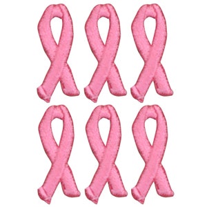 May include: Six pink ribbon patches. The ribbons are a symbol of breast cancer awareness.