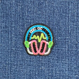 May include: A white ceramic mug with a black handle and the text "But First, Coffee" in a black, bold font. The mug is on a white surface. The mug is likely 11 ounces.