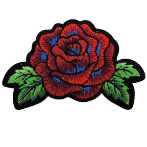 May include: An embroidered red rose with green leaves. The rose is a classic symbol of love and beauty.