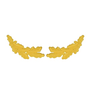 May include: A pair of yellow embroidered patches shaped like curved oak leaf branches. Each patch features a detailed stitched texture representing the organic form of leaves, designed to be applied as a decorative accent on various textile items.