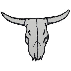 May include: White embroidered bull skull patch with black stitching. The skull is outlined in black and has a detailed design.