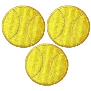 May include: Three circular embroidered patches, each featuring a bright yellow tennis ball design with characteristic curved white stitching lines. The embroidery creates a textured surface on each round patch, showcasing a consistent yellow thread color.