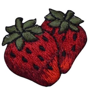 May include: Two embroidered red strawberries with green leaves. The strawberries are stitched with black thread to create a detailed design.