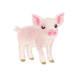 May include: An embroidered patch shaped like a standing piglet. The piglet is light pink with darker pink inner ears and snout, black eyes, and a small curled tail. The four hooves are detailed with a metallic gold thread finish.