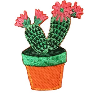 May include: Embroidered patch of a green cactus with pink flowers in an orange pot. The cactus has a detailed texture, and the pot has a simple design. The patch is likely for clothing or accessories.