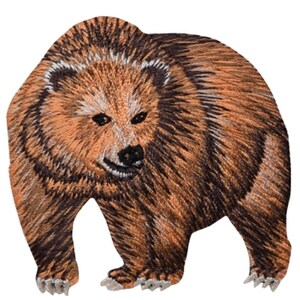 May include: Embroidered patch of a brown bear standing on all fours. The bear has a light brown muzzle and dark brown eyes. The patch is ideal for adding a touch of wilderness to your clothing or accessories.