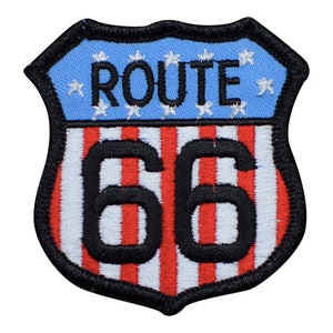 May include: A black and white embroidered patch with a blue background. The patch features the text "ROUTE 66" with red and white stripes.