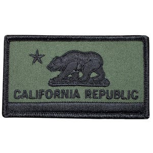 May include: A black and green embroidered patch with the California Republic flag. The patch features a black bear, a star, and the words "CALIFORNIA REPUBLIC".