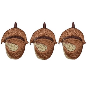 May include: Three brown embroidered acorn patches with a light brown centre.