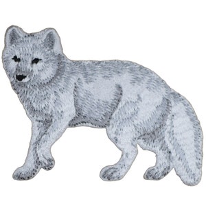 May include: A white embroidered patch of an arctic fox standing on all fours. The fox is facing the left side of the image. The patch is suitable for sewing or ironing onto clothing, bags, or other fabric items.