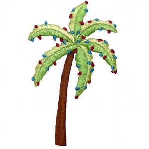 May include: An embroidered patch shaped like a palm tree with a brown trunk and light green fronds. The fronds are decorated with small, scattered red and blue embroidered dots throughout the leaves, creating a textured and colorful appearance.
