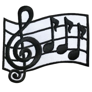 May include: Black and white embroidered patch featuring a treble clef and musical notes on a staff.