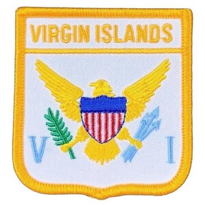 May include: A rectangular embroidered patch with a yellow border featuring the text VIRGIN ISLANDS in yellow. The center displays a yellow eagle holding a shield with red and white stripes and a blue top, a green olive branch, and blue arrows.