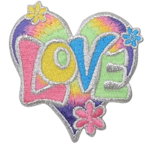 May include: A colourful embroidered patch in the shape of a heart with the word "LOVE" in a tie-dye pattern. The patch is surrounded by flowers.