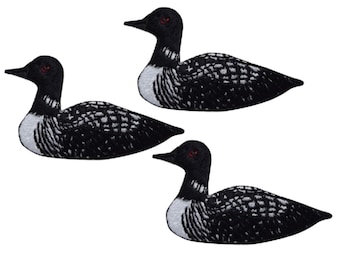 May include: Three black and white embroidered loon patches. The loons are in a swimming position with their heads turned to the side. The patches are perfect for adding a touch of nature to your clothing or crafts.